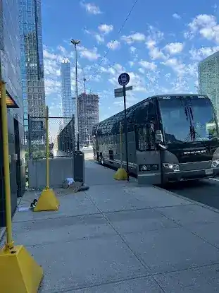 New York, NY (Hudson Yards - 11th Avenue between W. 35th and W. 36th Streets, across from Javits Convention Center. Look for bus stop signs that say Coach Express MA or Kleins Bus Service)