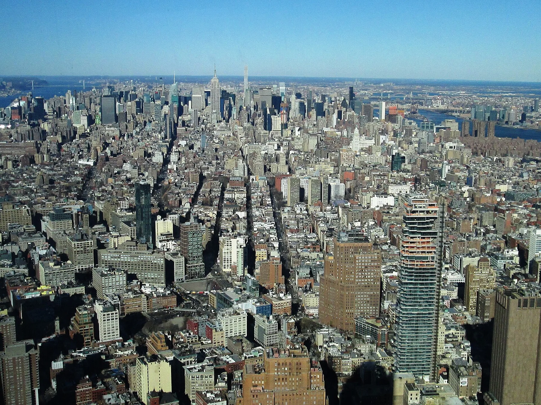 Long northward aerial view of Manhattan illustrating the island's north-south scale