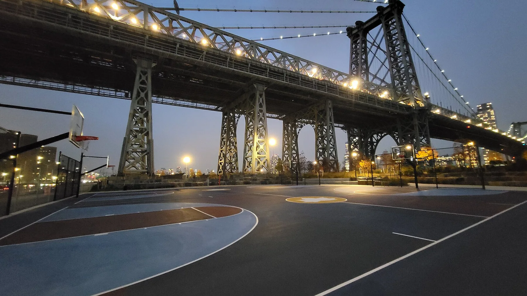 East River Park and the Williamsburg Bridge near Delancey Street as evening falls on the Lower East Side
