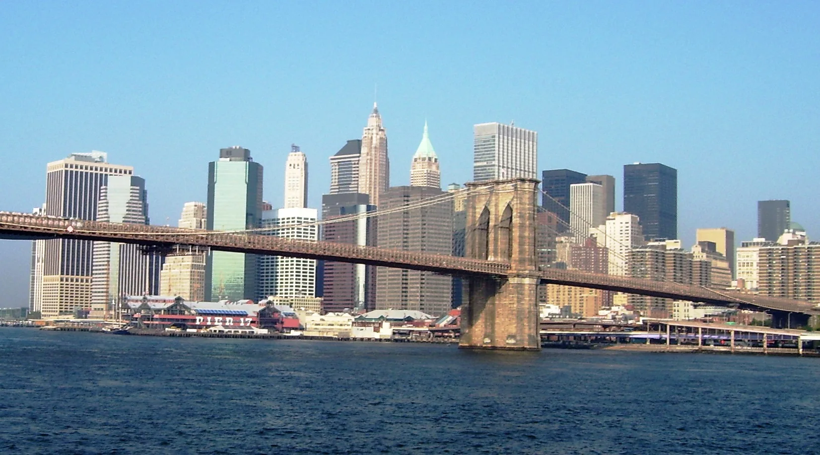 Brooklyn Bridge spanning the East River with Lower Manhattan behind it